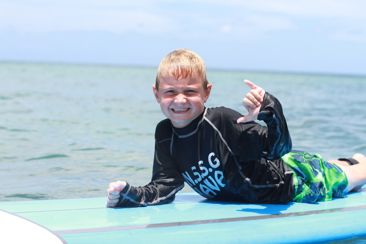 A very happy surfer boy