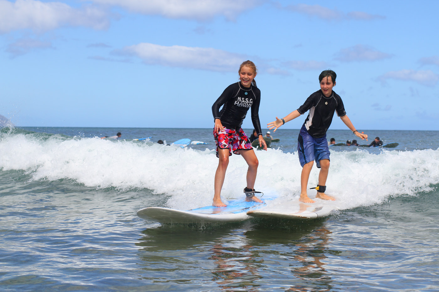 Learning to surf and share waves